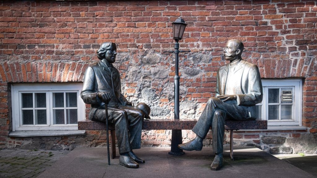 "Two figures in dialogue"