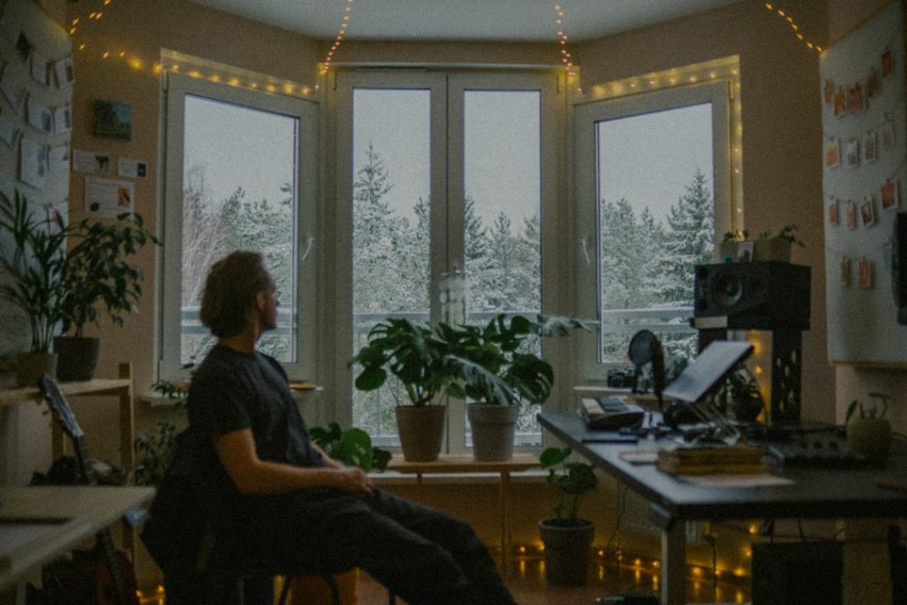 "Person alone by window - needing space"