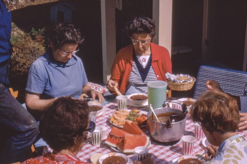 Two women sitting at a table in conversation
