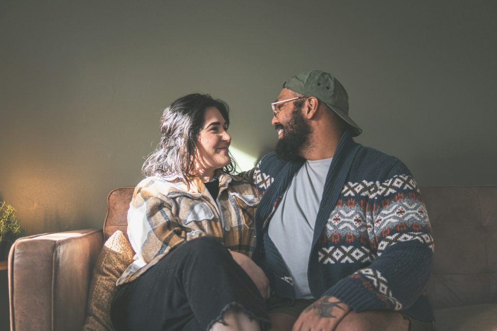 Couple sitting together on a couch